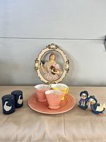 Full view of all items including plate, creamers, S&P shakers, and chalkware figurines