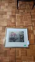 Framed print on parquet floor showing overall appearance