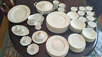 Full display of all dinnerware pieces on table.