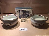 Two floral ceramic chamber pots with one small handle each, six clear glass beer mugs in original box