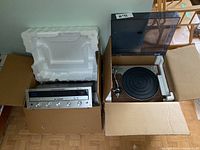 Turntable and receiver in original cardboard boxes with styrofoam packaging