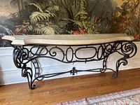 Full front view of console table showing entire stone top and wrought iron base