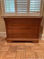 Front elevation of dresser showing three drawers and overall finish