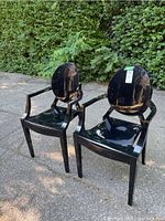 Both chairs front three-quarter view outdoors showing overall appearance