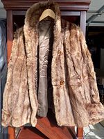 Full coat hanging, showing texture and lining