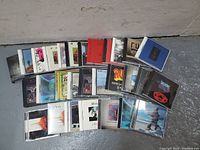 Front view of 33 Rush CDs arranged on ground showing album covers.
