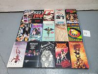 Front view of 15 heavy metal VHS tapes from various bands including KISS, Metallica, Megadeth, and Def Leppard.