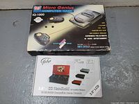 Micro Genius IQ-1000 console box and Yobo FC 16 Go handheld console box