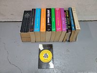 Front side view of all books in the lot and a small record label booklet in front.