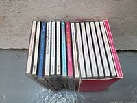 Set of 12 Sailor Moon anime music CDs in cases and one box set cover, with titles on spines mostly in Japanese.