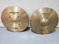 Front view of bottom and top cymbals showing Zildjian logos and model stamps.