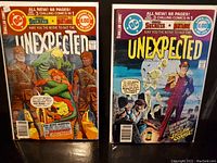 Front covers of two DC Comics Unexpected issues #190 and #192, showing vintage horror comic artwork in plastic sleeves.