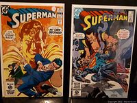 Two Superman comics #389 and #390 side by side, front cover visible, showing cover art and titles.