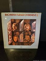 Front cover of Bachman Turner Overdrive II album showing band member collage and minor edge wear.