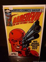 Front cover of Daredevil comic issue #184 showing Daredevil holding a large gun with caption 'No More Mister Nice Guy'. The comic is sealed in a protective plastic sleeve.