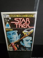 Front cover of Star Trek The Motion Picture #1 comic book showing main characters and spaceship.