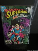 Front cover of Superman comic book #401 showing the title, artwork of Superman restrained, and DC logo.
