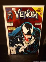 Front cover of Venom Lethal Protector comic #1 showing Venom character with large open mouth and sharp teeth, text includes guest-starring Spider-Man and part one of six.