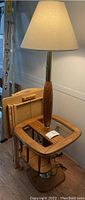 Floor lamp with wooden base and storage shelves, TV tray table folded beside it, showing dimensions and condition.