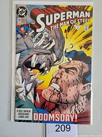Photo of DC Comics Superman The Man of Steel #19 comic book showing the cover with Superman fighting Doomsday, with visible price of 60 cents and issue number 19.