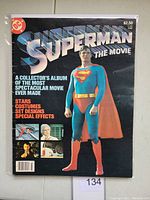 Cover of the comic book showing Superman posing with information about movie features (stars, costumes, set designs, special effects).