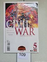 Photo of Marvel Civil War #5 comic book in protective sleeve, showing full front cover artwork and title.