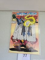 Photo of the comic book Marvel Comics Presents Wolverine issue 100 showing front cover with Wolverine and Ghost Rider imagery.