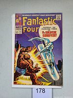 Front cover of Fantastic Four #55 comic showing key Silver Surfer character in dynamic battle pose.