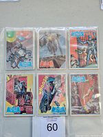 Six 1966 Batman non-sports trading cards in protective sleeves arranged in two rows of three.