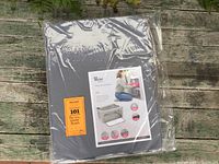 Front photo of packaged gray Periea storage bins showing product branding and packaging