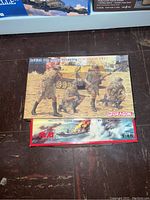 British 8th Army Infantry El Alamein 1942 and WWII German naval model kits on the floor.