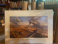 Signed limited edition print 'The Battle of Kursk' depicting WWII battle scene with aircraft and tanks in landscape, with white border and signatures.