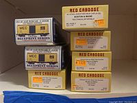 Boxes of vintage HO scale model train cars arranged for display showing branding and product names.