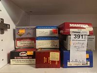 Front view of stacked boxes showing brands and model types