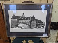 Front view of framed limited edition black and white print of Narragansett Towers with silver metallic frame and white mat border.