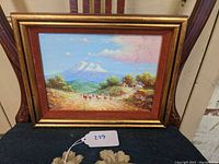 Full view of framed oil painting showing El Chimborazo mountain with rural landscape, llamas, and figures.