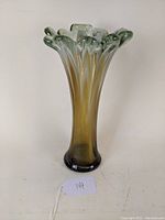 Front view of the mid-century art glass vase showing color gradient from amber base to aqua-tinted fluted top with ruffled edges.