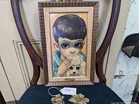 Overall view of framed print on chair