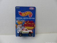 Front view of Hot Wheels 1994 C. Rex Mobile limited edition sealed in original blister with blue Kraft branded card showing dinosaur mascot and text