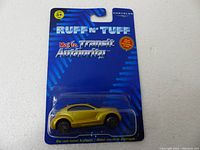 Full view of the Maisto Transit Authority Ruff n Tuff Chrysler toy car sealed in original packaging with blue card and plastic blister.