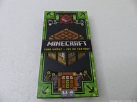 Front of the Minecraft Card Game box showing game title and Minecraft crafting table graphics