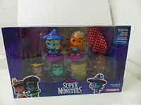 Boxed playskool super monsters moonlight pack with six collectible figures visible through front window.