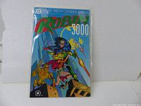 Full front cover of Robin 3000 Book #1 in protective sleeve, showing vibrant artwork and title.