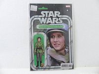 Photo showing front packaging with comic and figure of Princess Leia Organa in green poncho combat outfit.