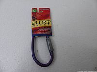 Front photo of the purple waterproof Surf Watch in original packaging showing brand name and waterproof feature.