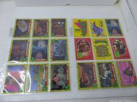 16 Teenage Mutant Ninja Turtles 1989 Topps trading cards arranged front side up, showing colorful cartoon characters with green-yellow borders.