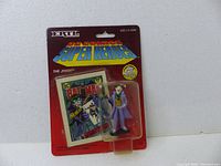 Front view of original Ertl DC Comics Super Heroes packaging featuring The Joker figure and comic book replica.