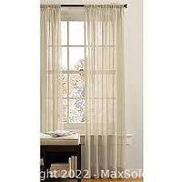 Better Homes & Gardens crushed sheer panel curtain hung on a window, showing fabric texture and color in natural light.