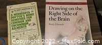 Photo showing both books: 'Drawing on the Right Side of the Brain' and 'A Minnesota Doctor's Home Remedies for Common and Uncommon Ailments'.