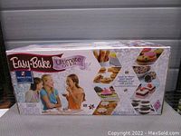 Box packaging showing Easy Bake Ultimate Oven Baking Star Edition branding and baked goods photos